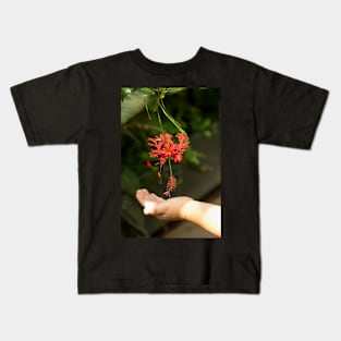 Child's hand touching beautiful butterfly Kids T-Shirt